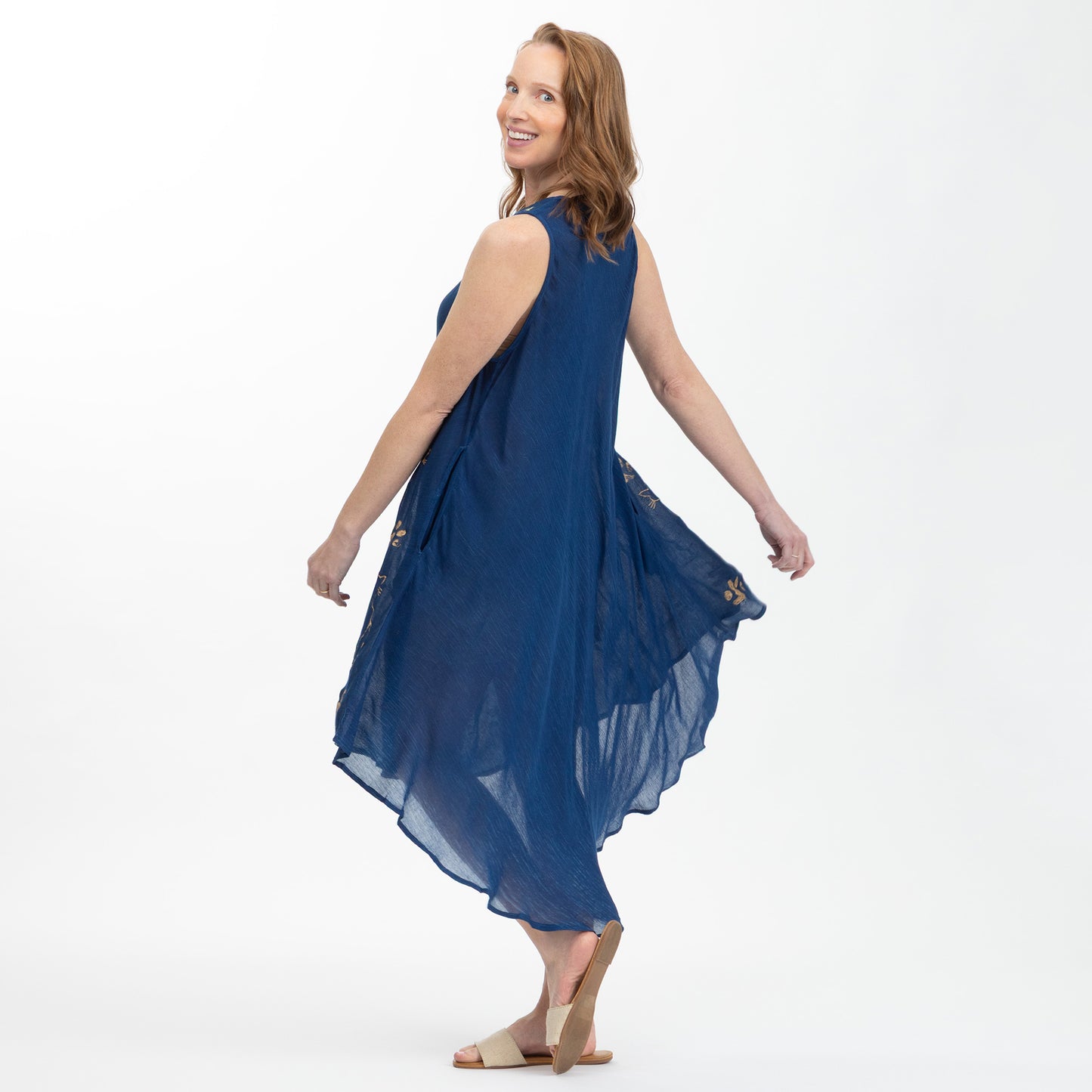 Woman wearing a blue dress on a white background