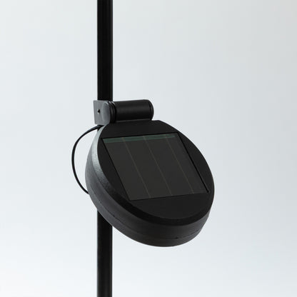 a close up image of the solar component of the garden stake