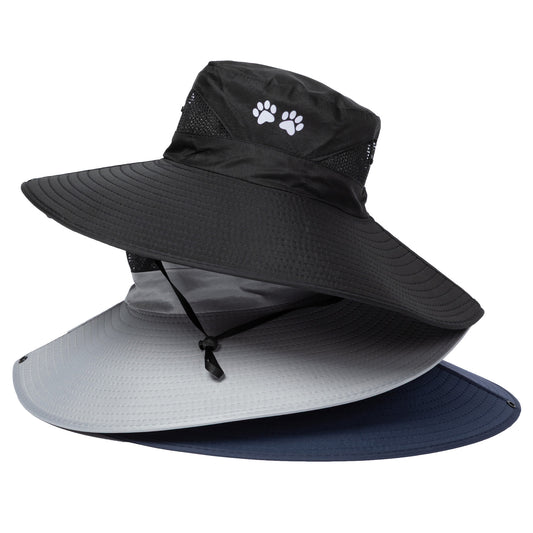 Black sun hat with a paw print logo, gray sun visor, and navy brim on a white background