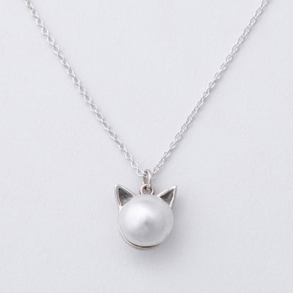 Silver cat-shaped pendant necklace on a light gray background