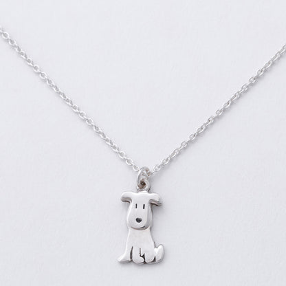 Silver dog-shaped pendant on a chain against a white background