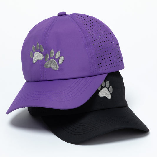 Purple and black baseball caps with paw prints on a white background