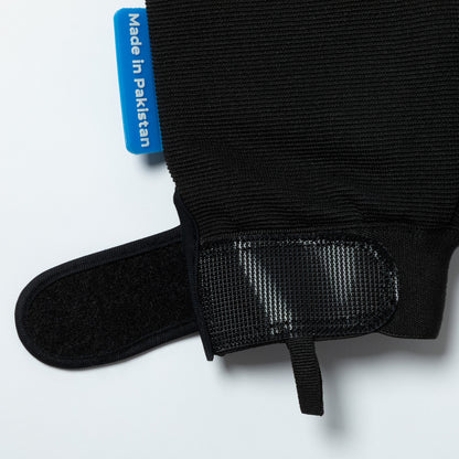 Black glove with a 'Made in Pakistan' label on a white background