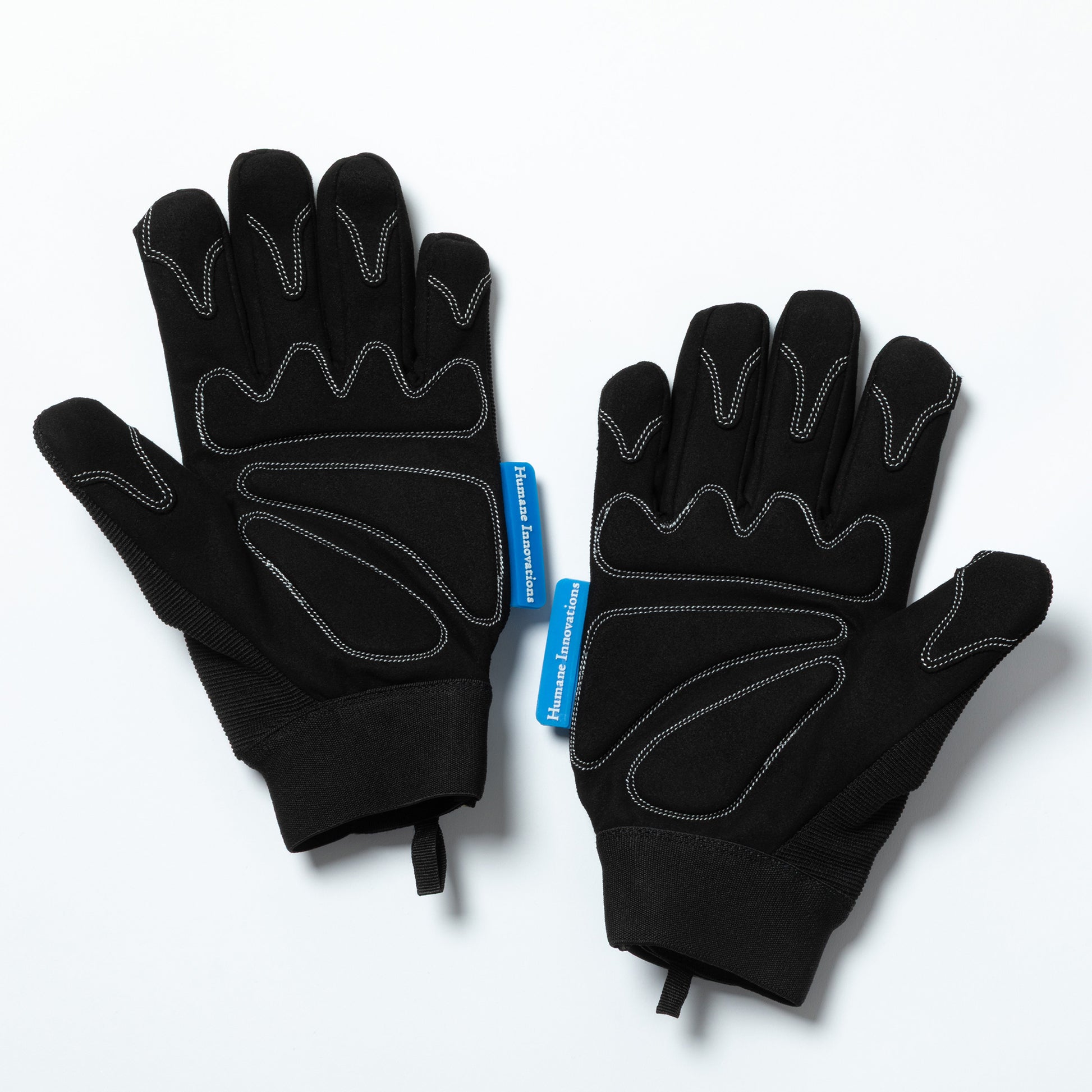 Pair of black gloves with a blue tag on a white background