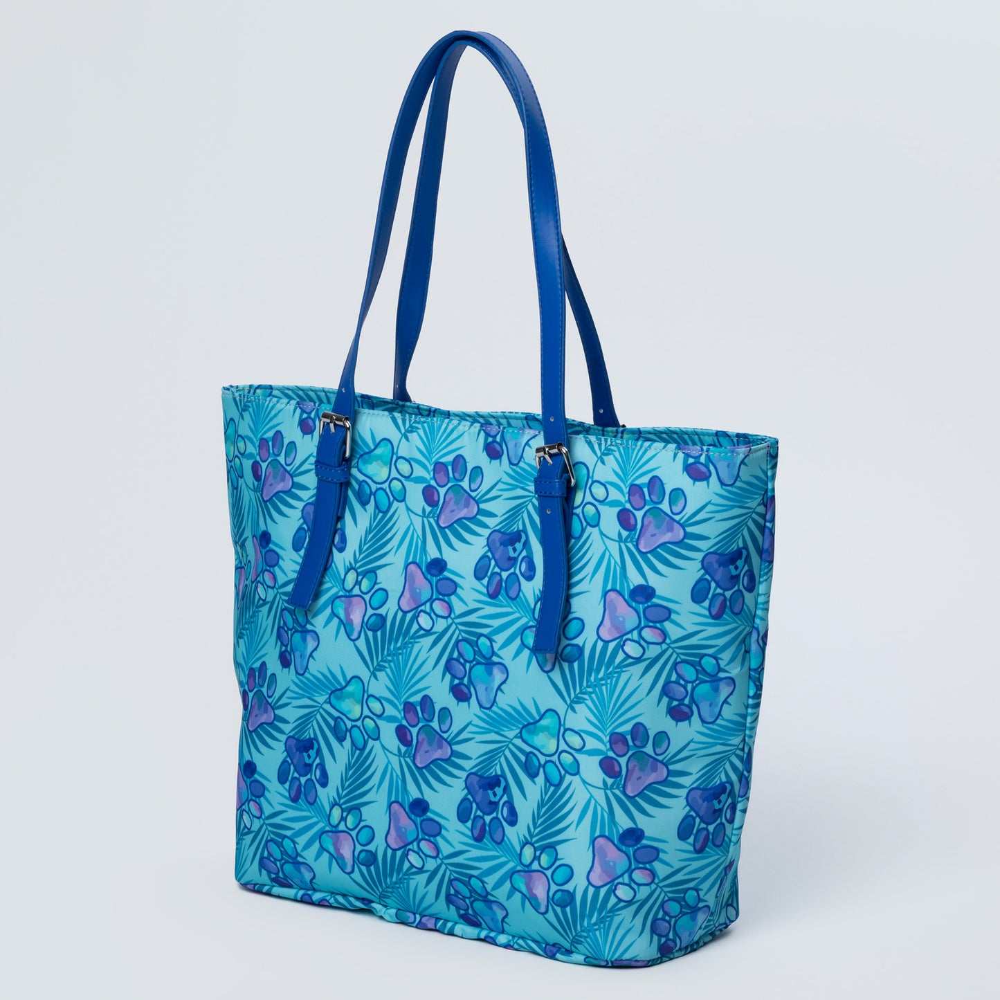 Blue tote bag with paw print pattern on a white background