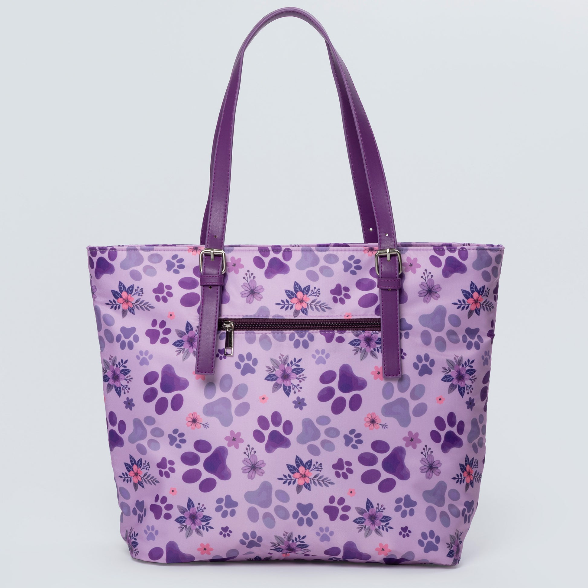 Purple tote bag with paw print pattern on a light purple background