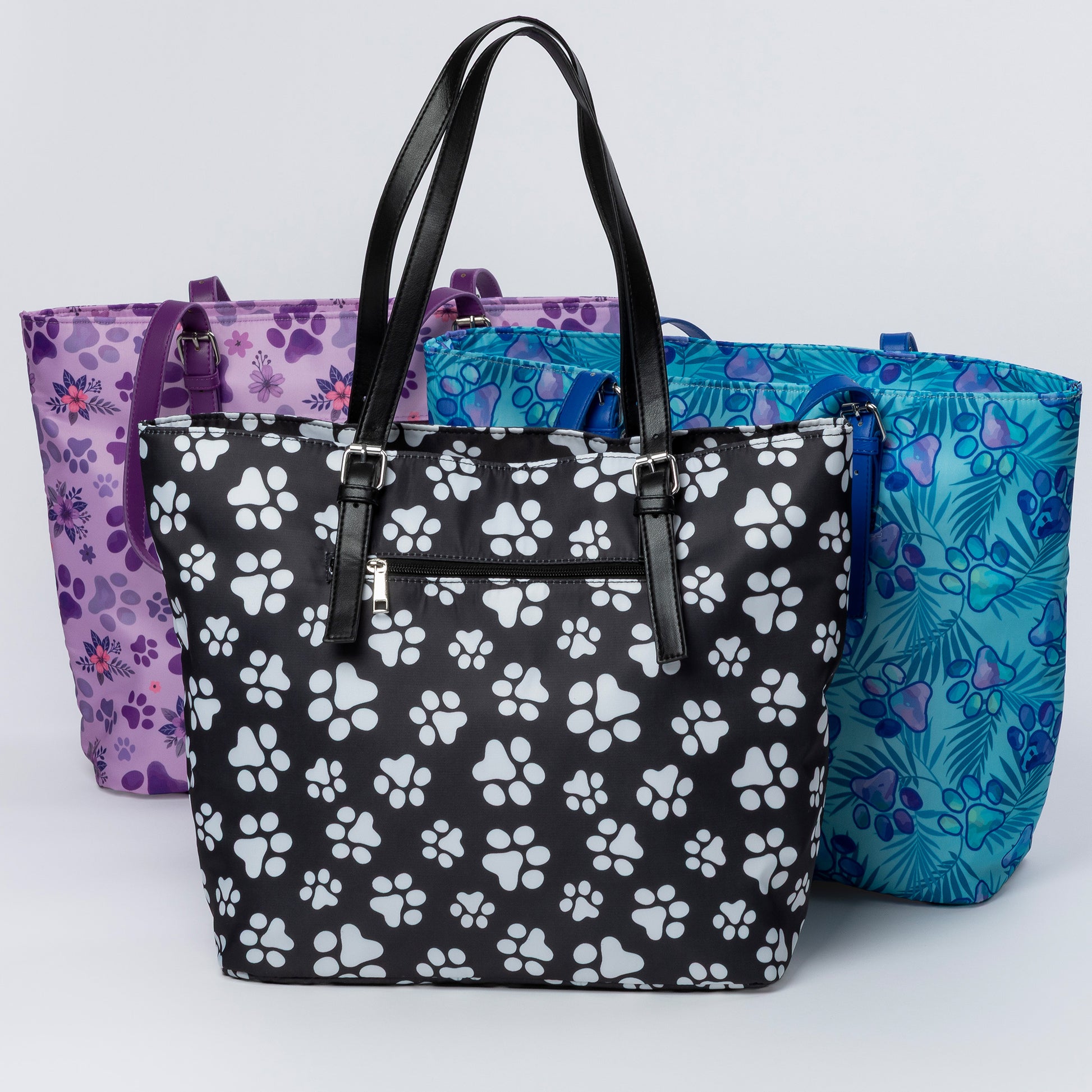 Three handbags with different patterns on a light gray background