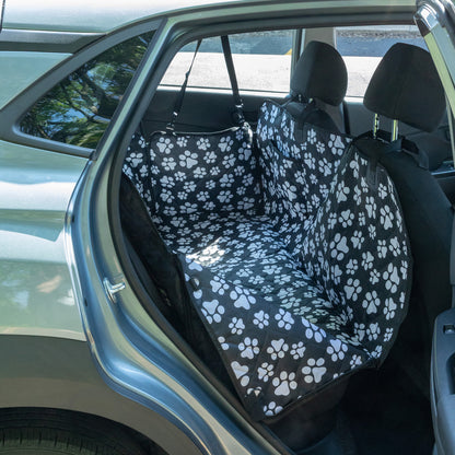 Car seat cover with paw pattern installed in a vehicle
