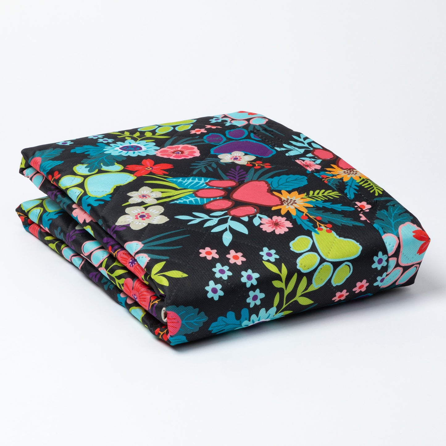 Folded fabric with colorful floral pattern on a white background