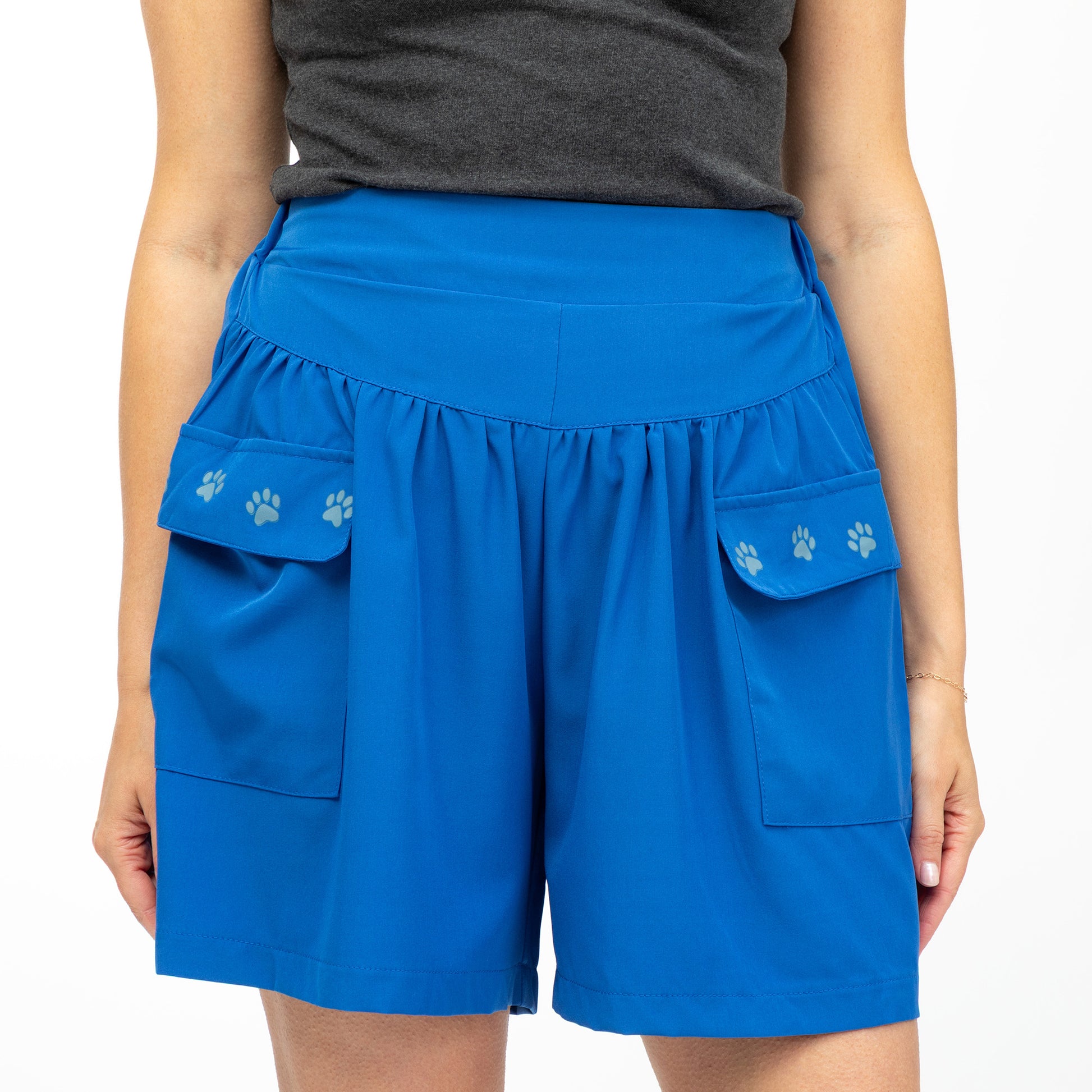 Blue shorts with paw prints on a white background