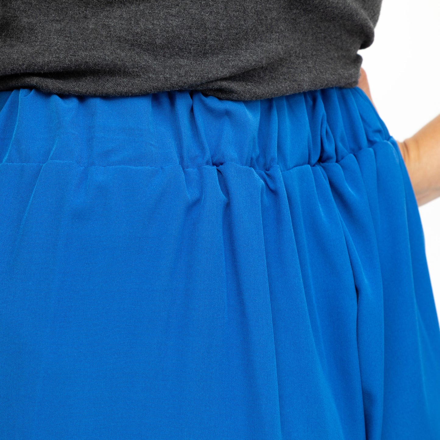 Blue shorts with a gray top on a white background