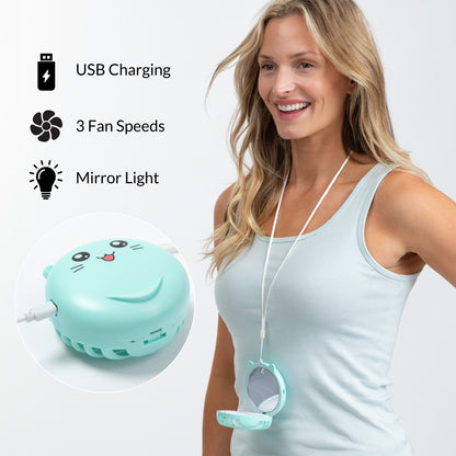 A woman wearing a mint green neck fan with an attached mirror, shown in a studio setting with feature callouts: USB Charging, 3 Fan Speeds, and Mirror Light. The product is displayed both on the model's neck and in a circular inset close-up.