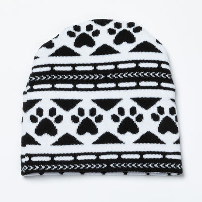 Black and white patterned beanie with paw prints on a white background