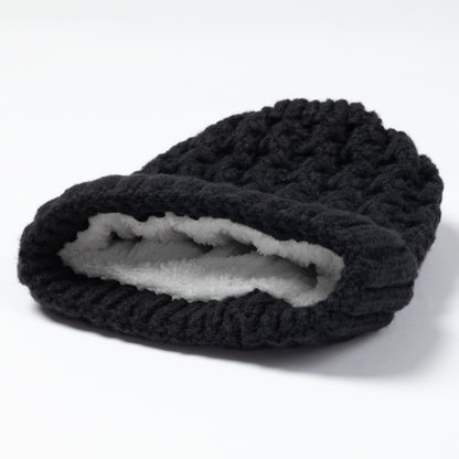 A black textured knit beanie hat with a soft white fleece lining, shown on a clean white background.