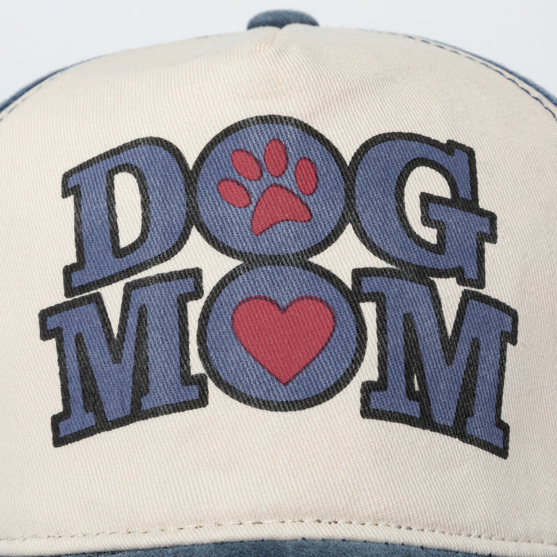 Cap with 'DOG MOM' text and paw prints on a white background