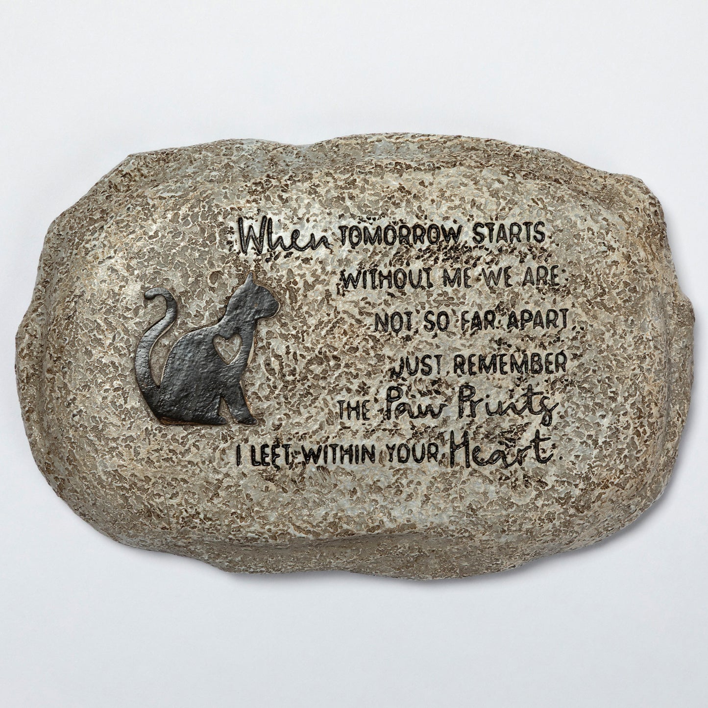 Decorative stone with a cat silhouette and engraved text on a white background