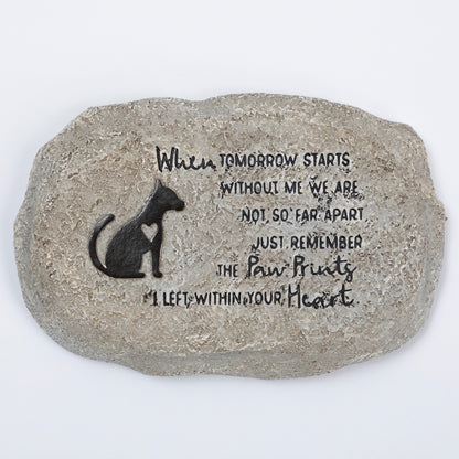 Decorative stone with a dog silhouette and engraved text on a white background