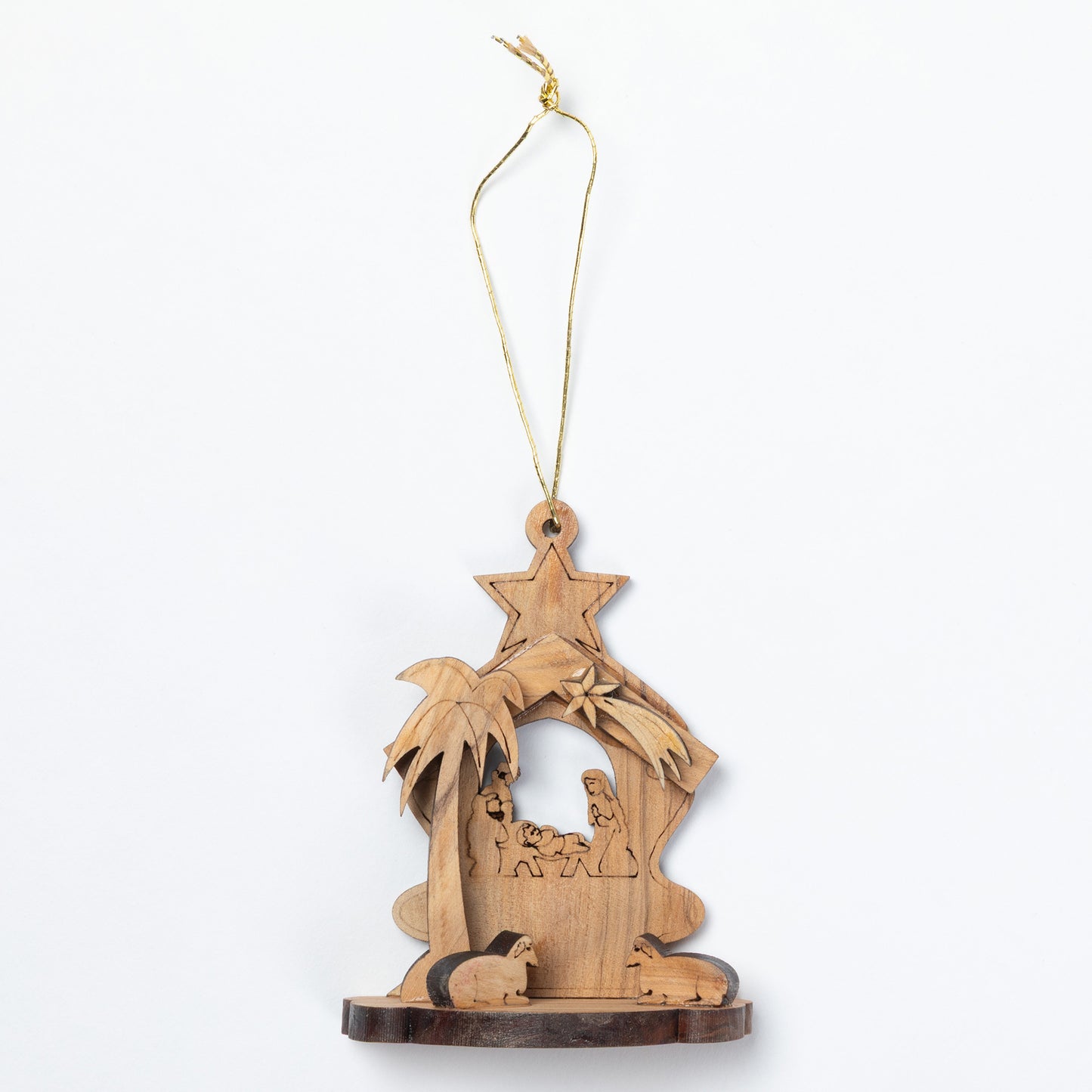 A handcrafted wooden nativity ornament featuring a star-shaped roof, palm tree, stable scene with baby Jesus, Mary, Joseph, and animals, hanging from a gold string on a white background.