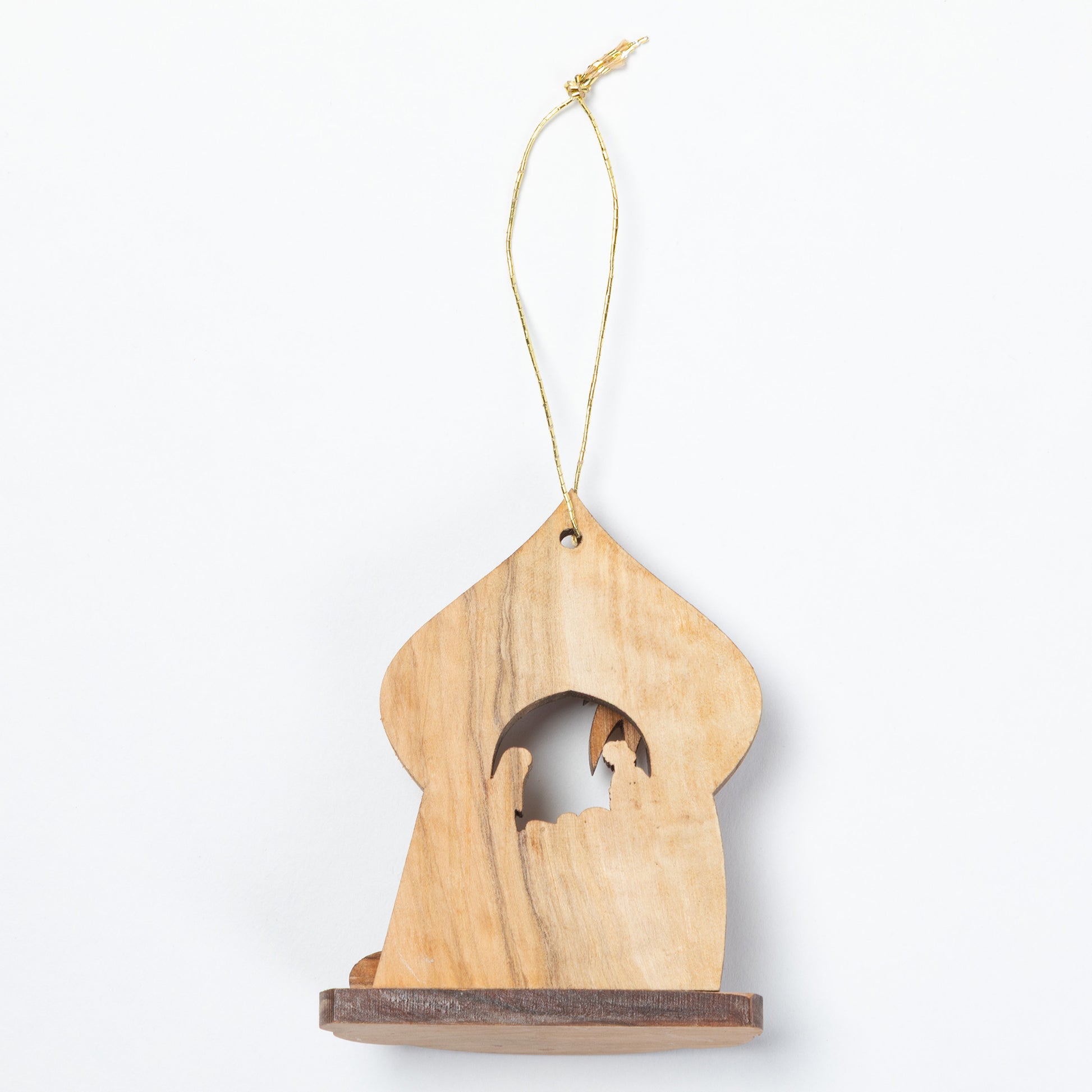 A small wooden hanging ornament shaped like a house with a cutout figure in the center, suspended by a thin gold string on a plain white background.