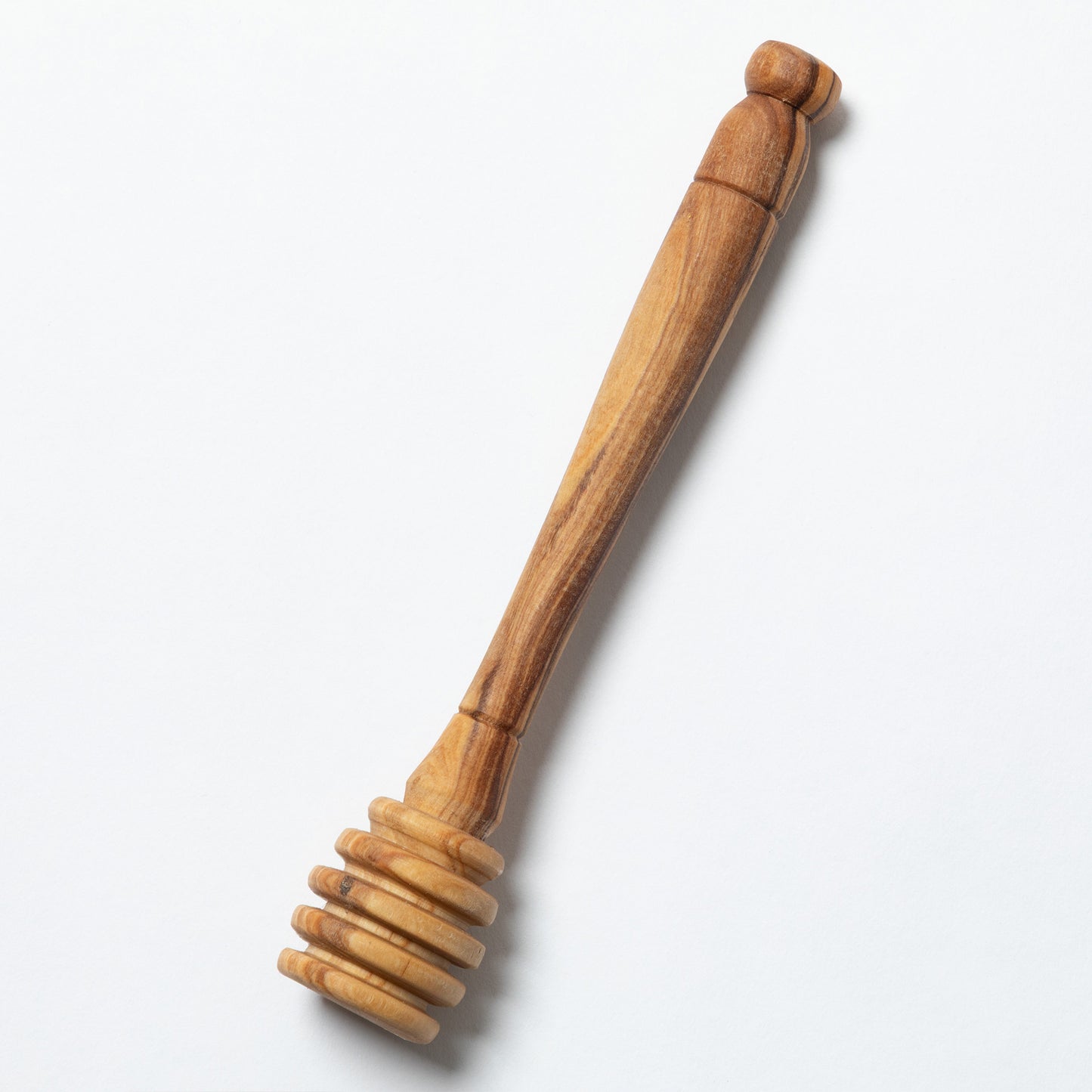 A handmade wooden honey dipper shown against a plain white background.