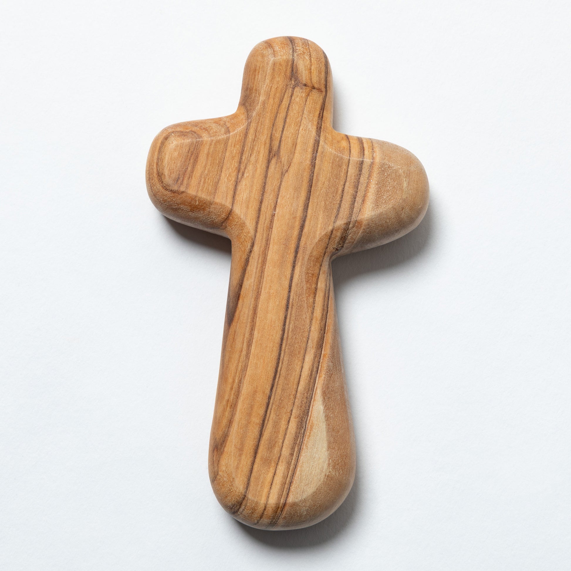 A handcrafted wooden cross with a polished olive wood grain pattern, shown on a clean white background.