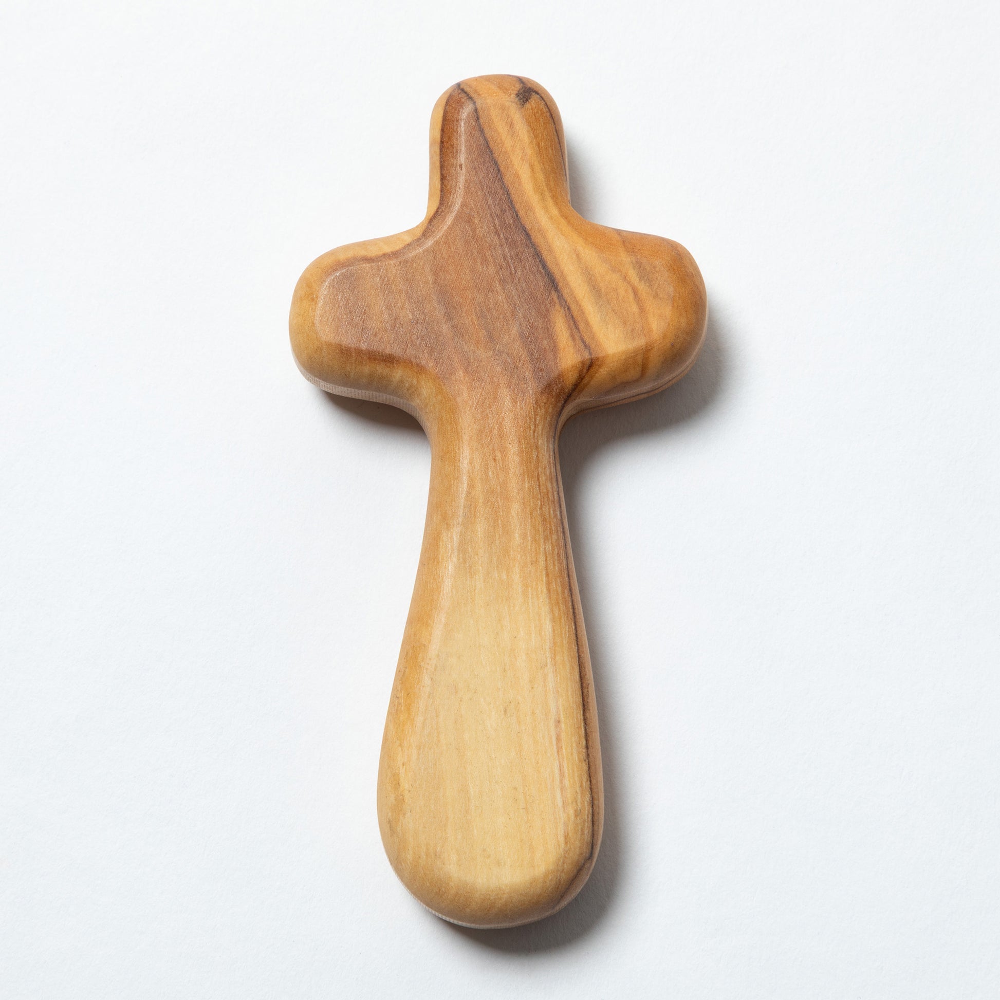 A handcrafted wooden cross with a natural olive wood grain pattern, shown on a white background.