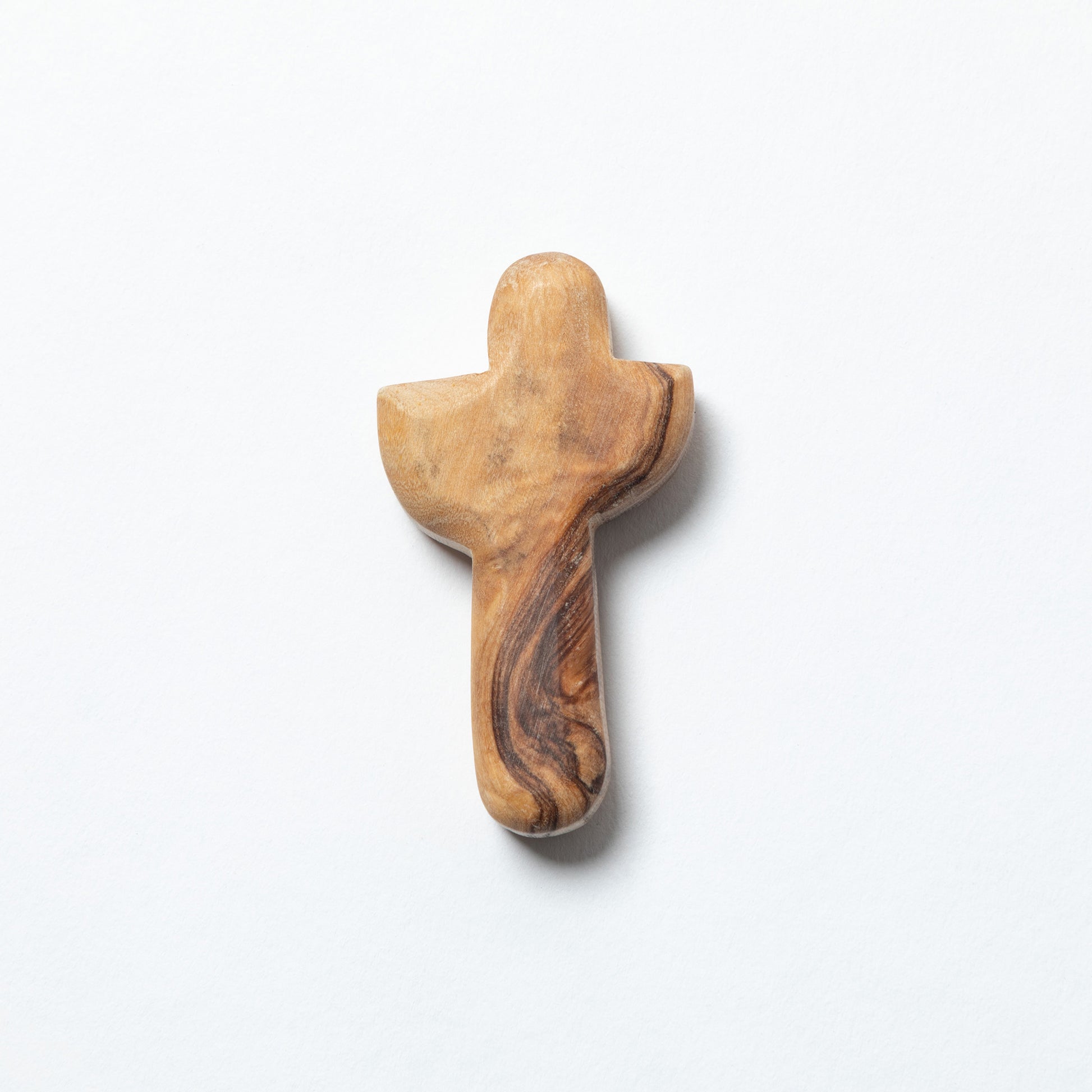 A small hand-carved wooden cross with natural olive wood grain patterns, shown on a clean white background.