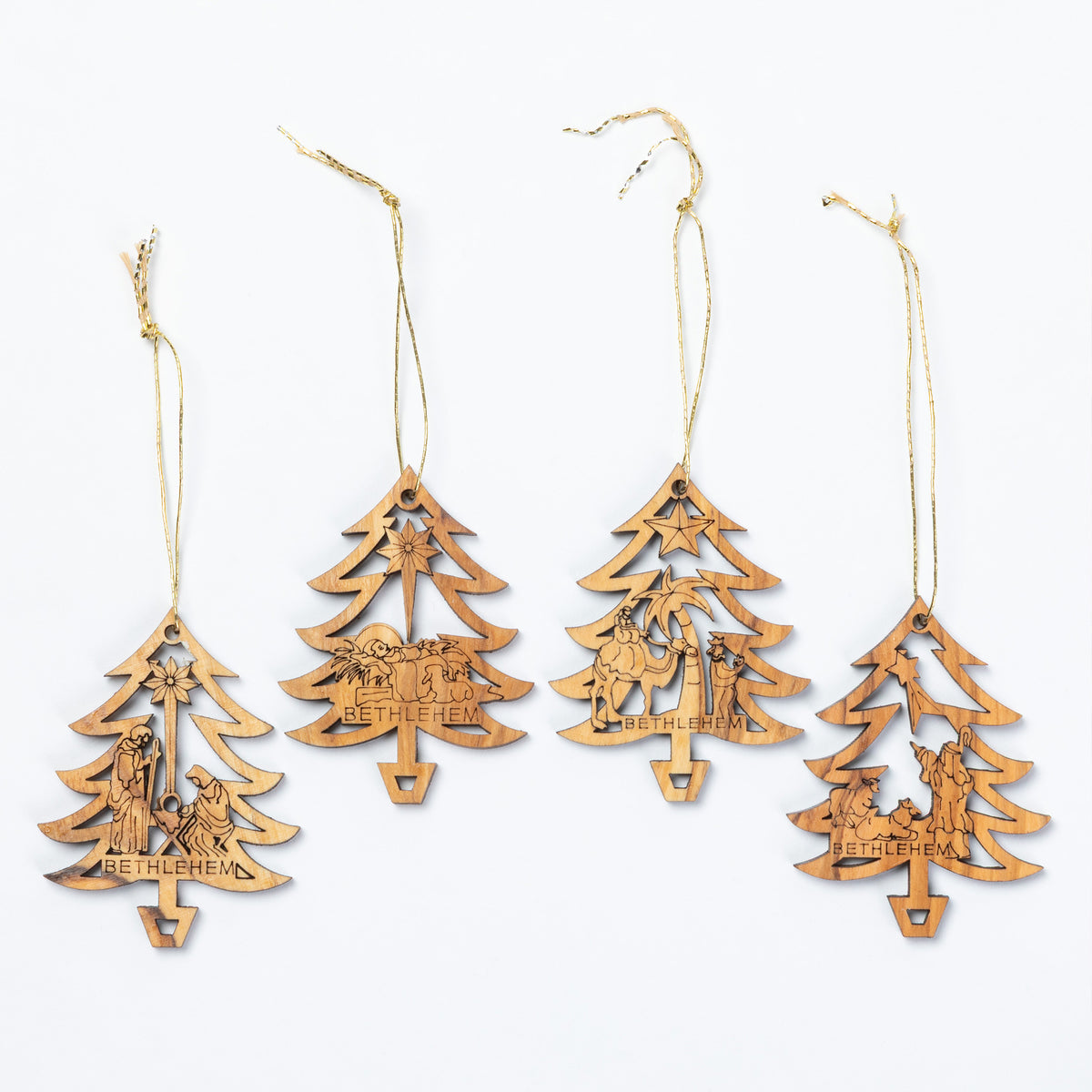 Four laser-cut wooden Christmas tree ornaments with hanging twine, featuring engraved scenes and the word 'BETHLEHEM' on a white background.