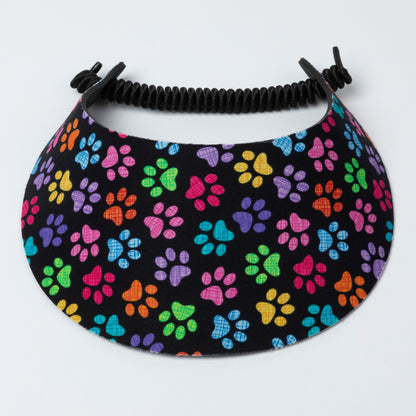 Visor with colorful paw pattern on a black background