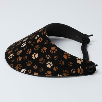 Black visor with brown paw print pattern on a light gray background