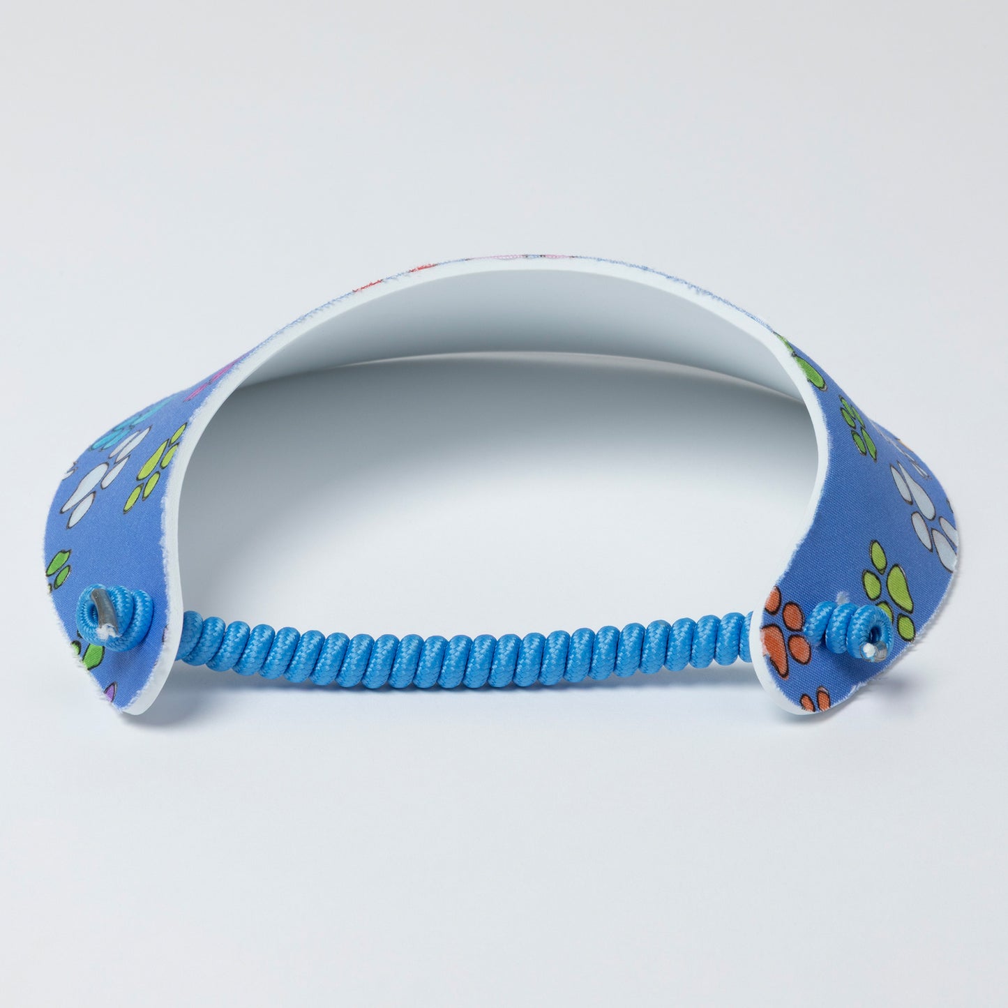 Blue visor with a paw print pattern on a light gray background