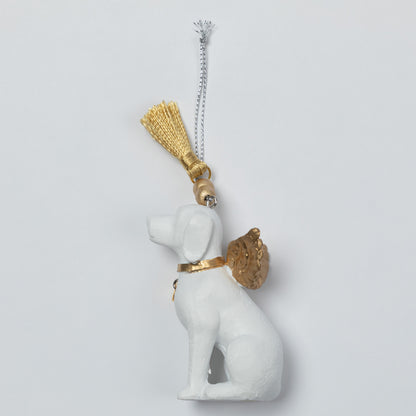 A white angel dog ornament with gold wings, collar, and tassel, hanging from a silver chain against a light gray background.