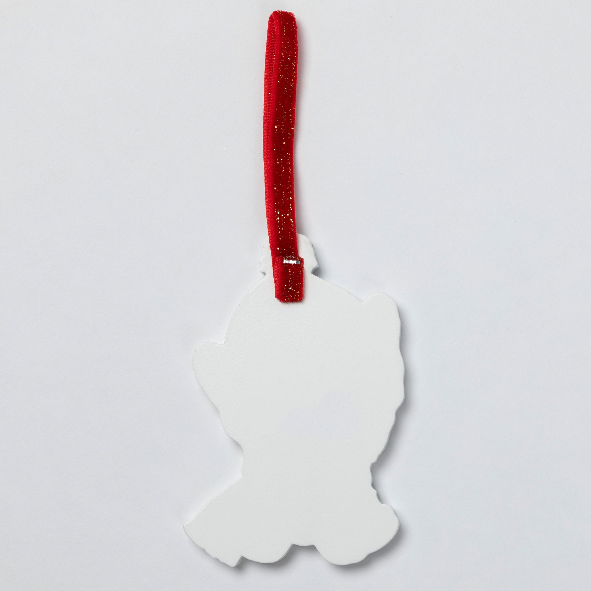 A white silhouette-shaped hanging ornament with a red glittery ribbon loop, shown against a plain light gray background.