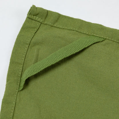 Close-up of green dish towel and loop with a white background