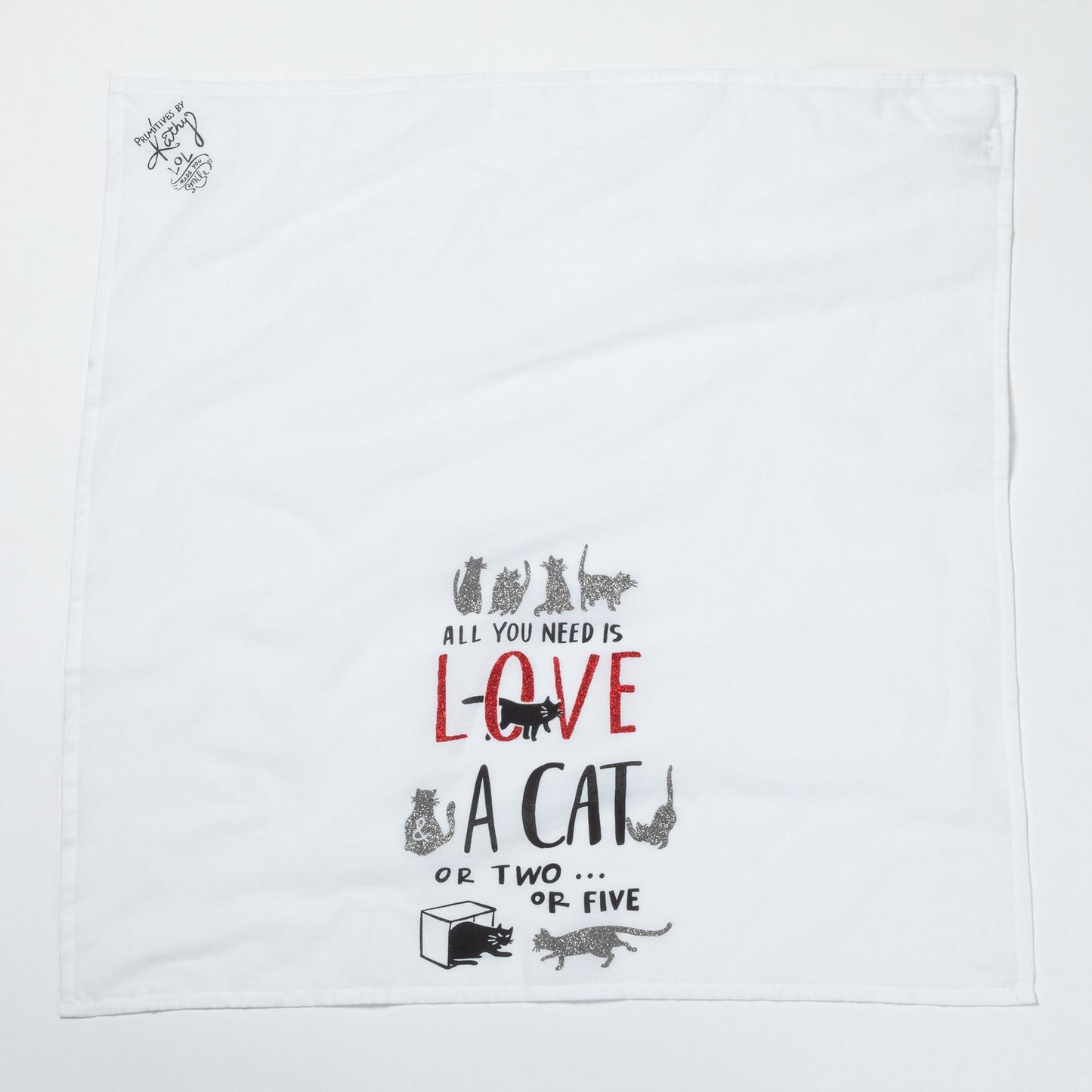 White towel with black text and cat illustrations on a white background