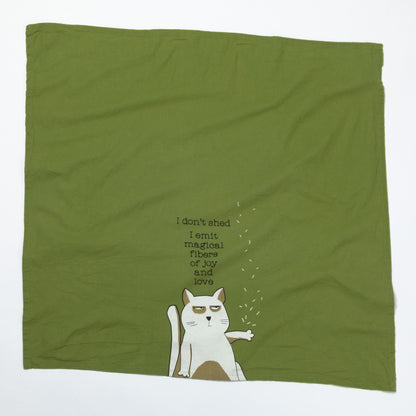 Green dish towel with a cat illustration and text on a white background