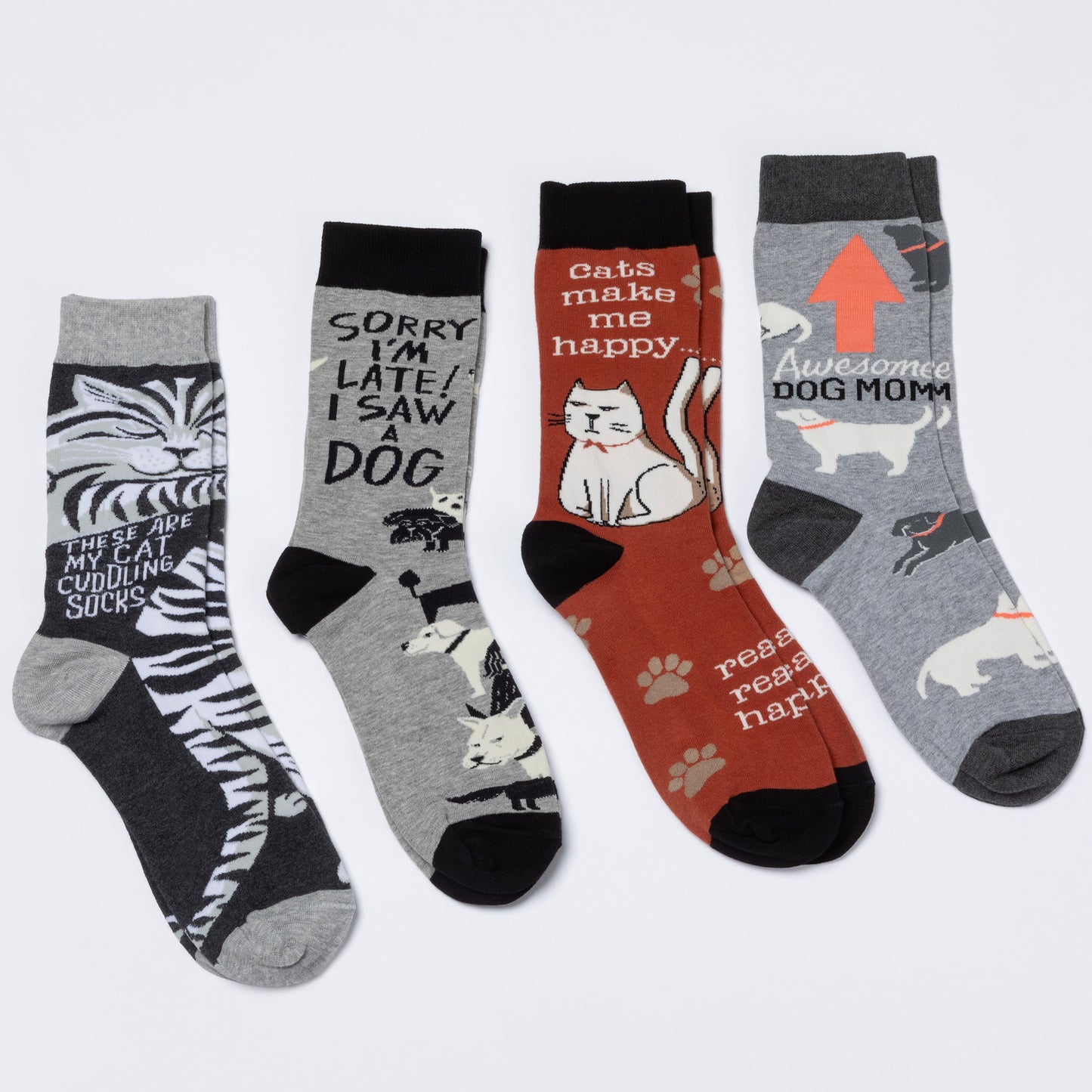 Set of four socks with cat and dog-themed designs on a white background.