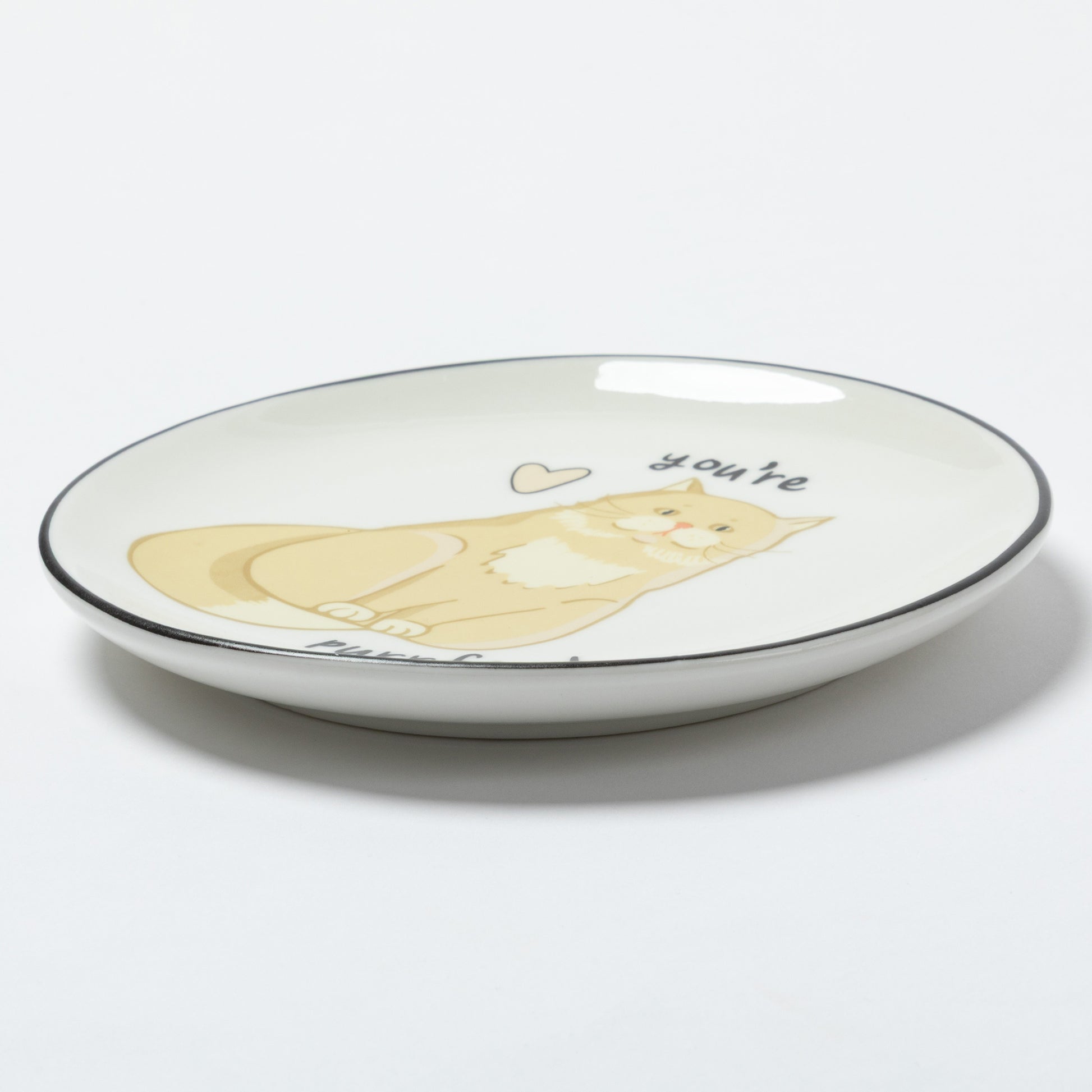 A white ceramic shallow plate with a black rim, featuring a cartoon illustration of a yellow cat and the word 'you're' printed on the side, set against a plain white background.