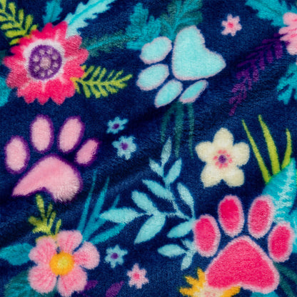 Floral and paw print pattern on a dark blue background