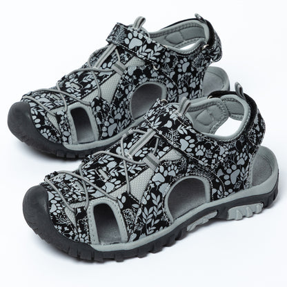 Pair of black and gray patterned sandals on a white background