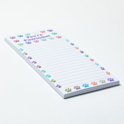 Notepad with colorful paw prints and text on a white background