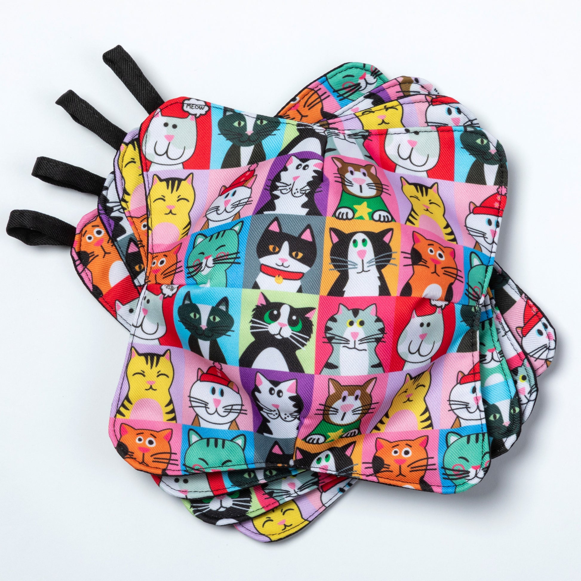 A set of four bowl cozies with various patterns, including a cat print design, pet portrait cat