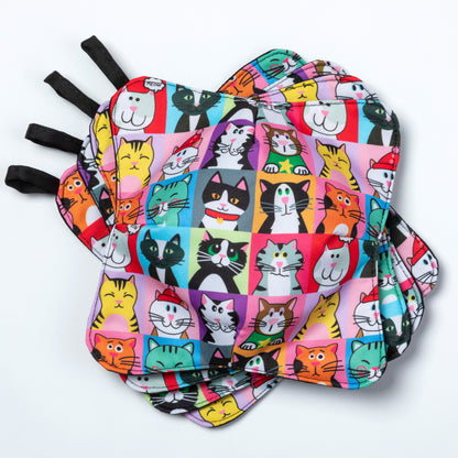 A set of four bowl cozies with various patterns, including a cat print design, pet portrait cat