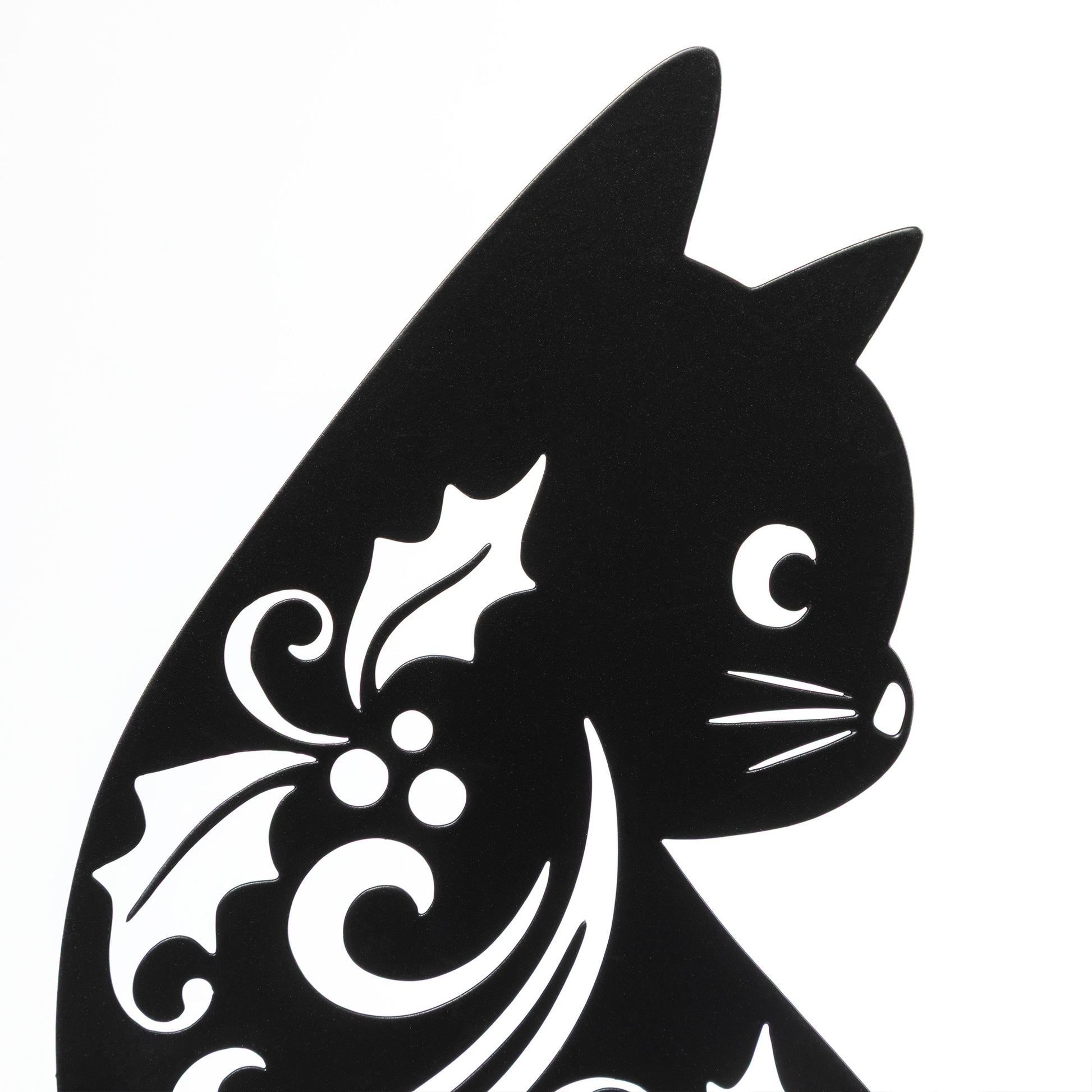 Black silhouette of a cat with decorative patterns on a white background