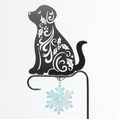 Decorative metal dog silhouette with floral patterns and a snowflake ornament on a white background