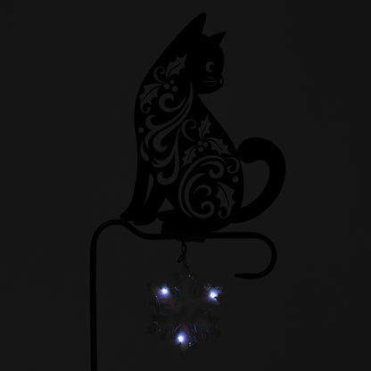 Decorative black cat silhouette with blue lights on a dark background