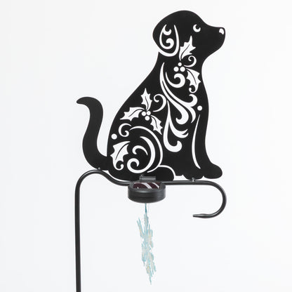 Decorative metal dog silhouette with white patterns on a white background