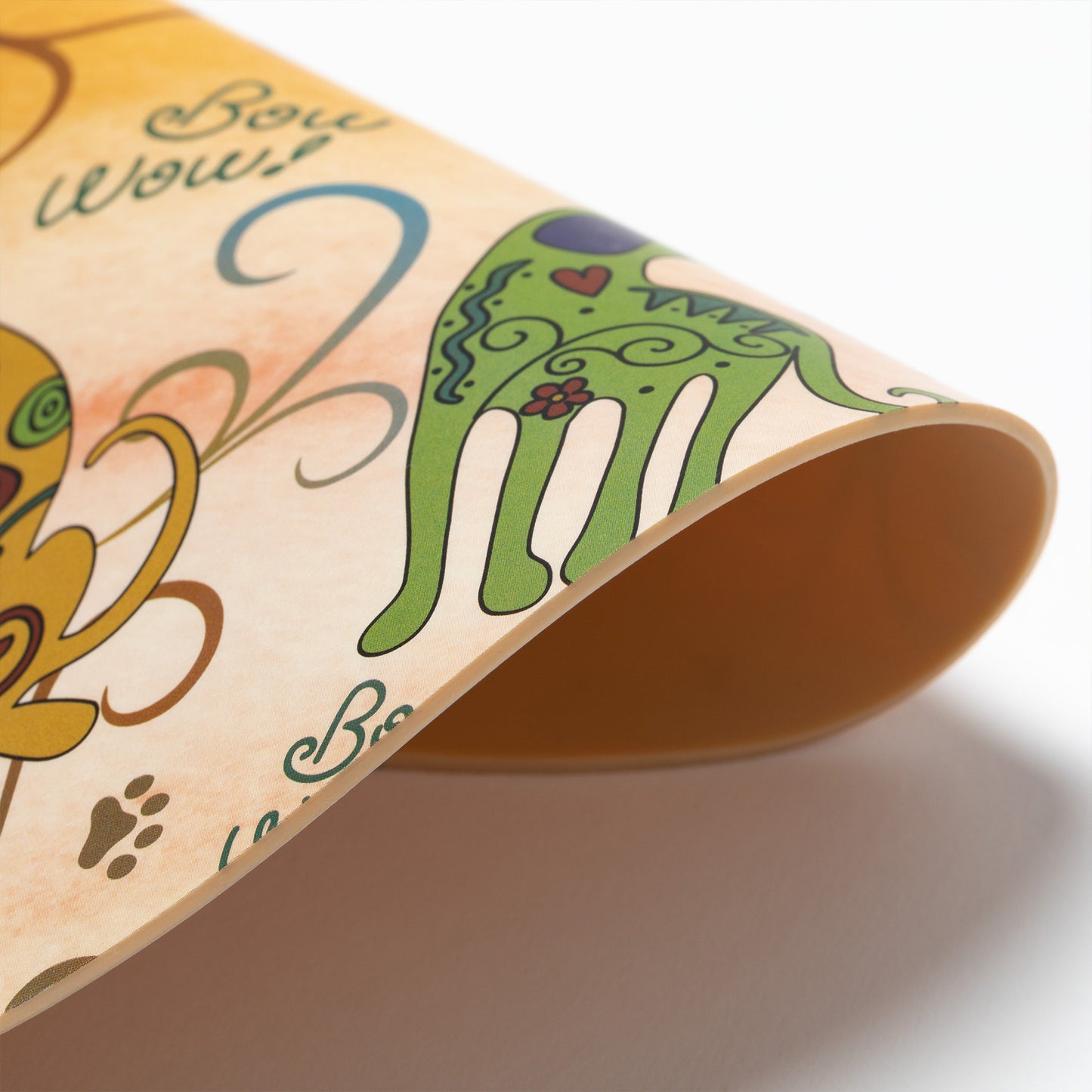 Silicone non-slip jar opener with colorful dog illustrations and 'Bow Wow!' text on a yellow background