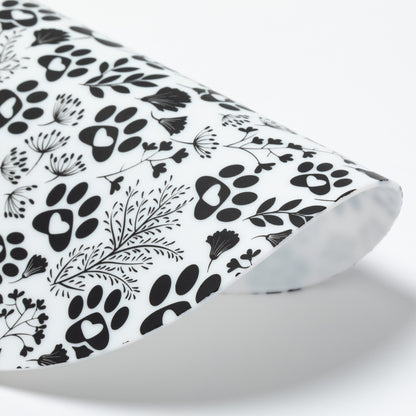 Silicone non-slip jar opener with black paw prints and leaf patterns on a white background