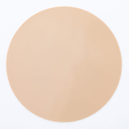 The beige back of a silicone non-slip jar opener 